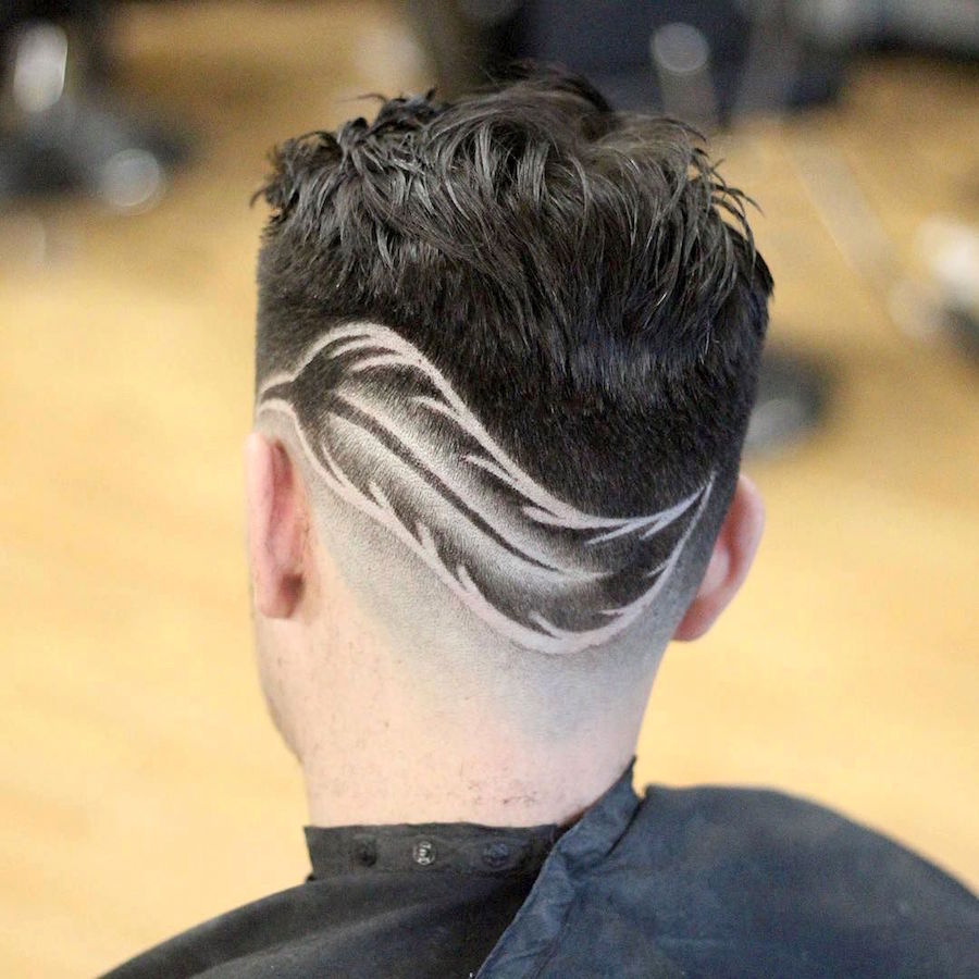 barberdiaz_and sharp fade haircut with feather design
