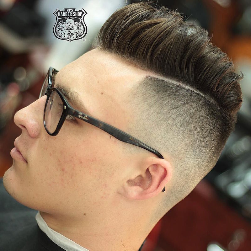 The high skin fade and hard part puts the emphasis on the pomp