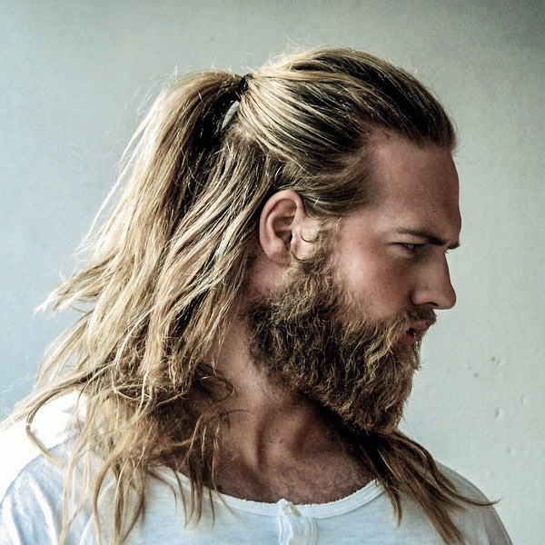 Half up half down hairstyle for men with long hair