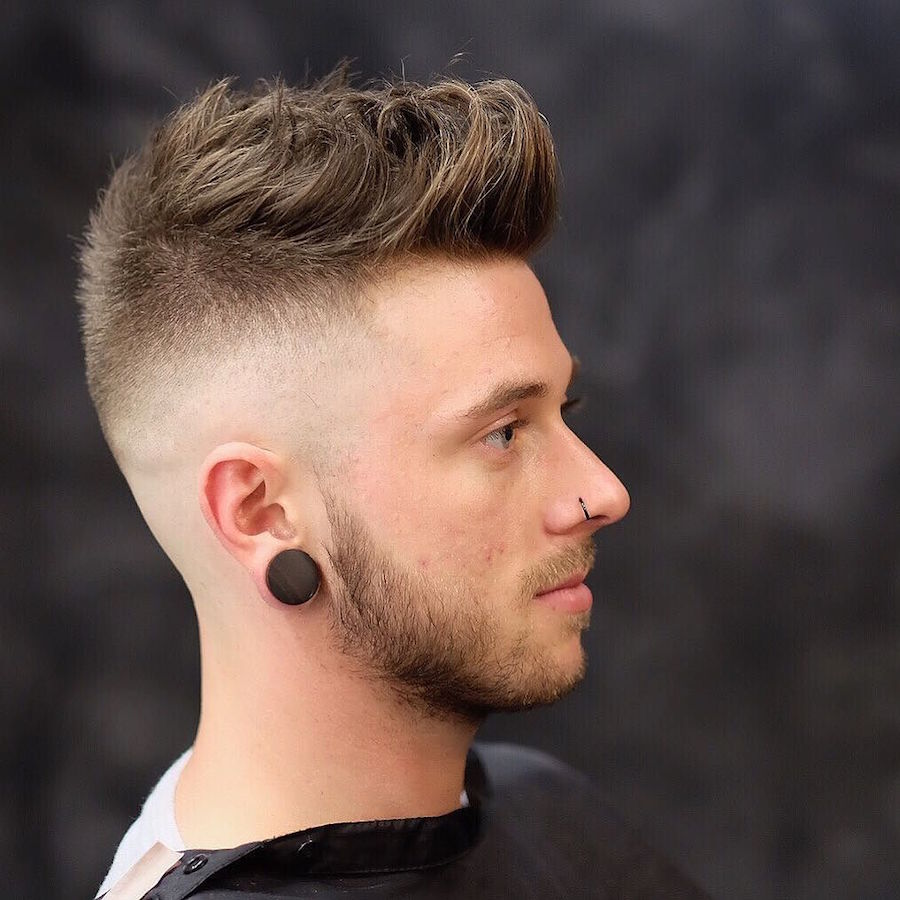rokkmanbarbers_and mid to high skin fade longer textures on top
