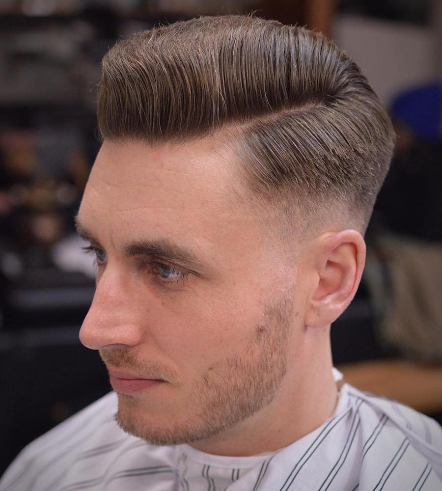 Skin fade side part medium length hairstyle for men