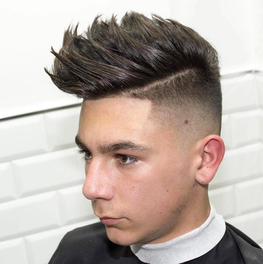 javi_thebarber__and high fade longer textured hair on top mens hairstyle