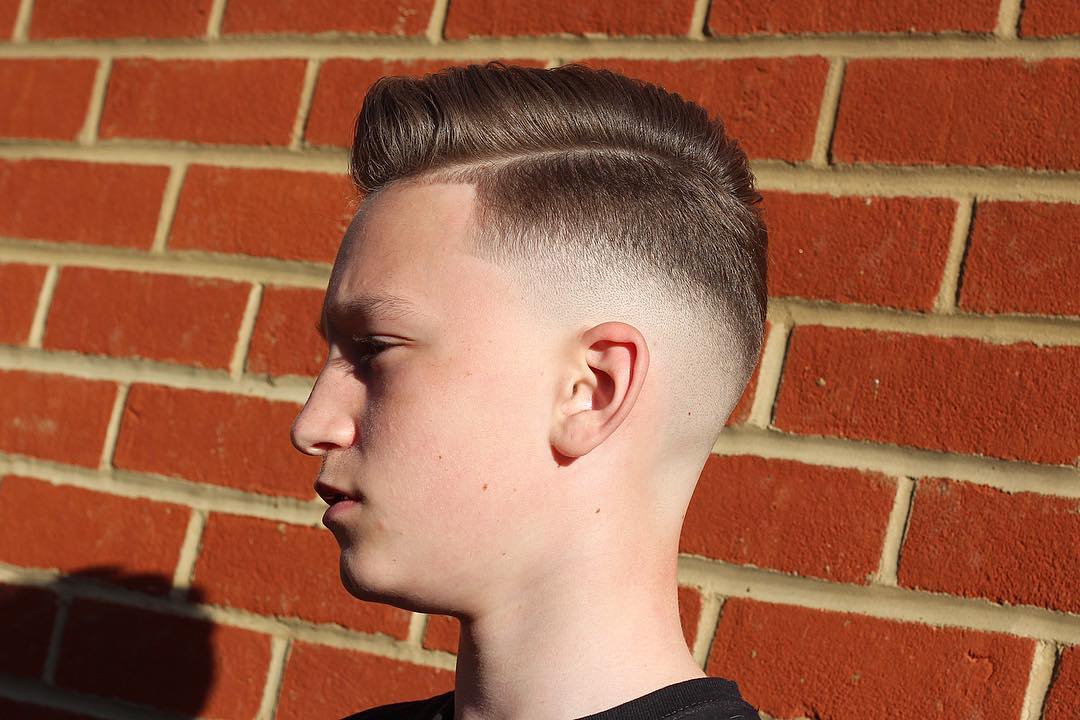 Side part hairstyle for summer and bald fade