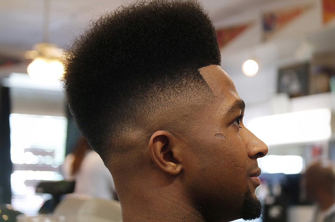 High top haircut with mid bald fade