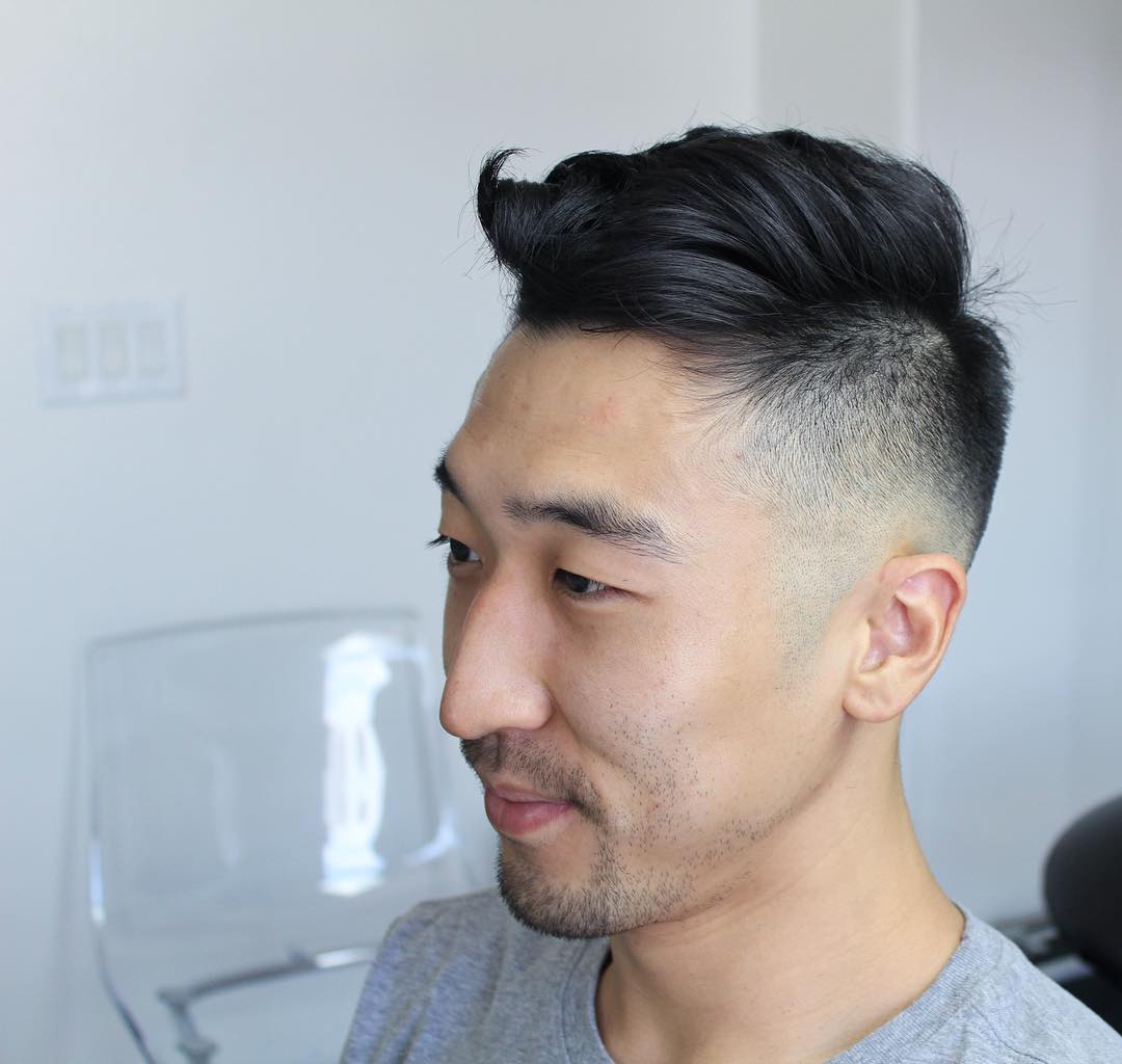 Short hair undercut for men with low bald fade