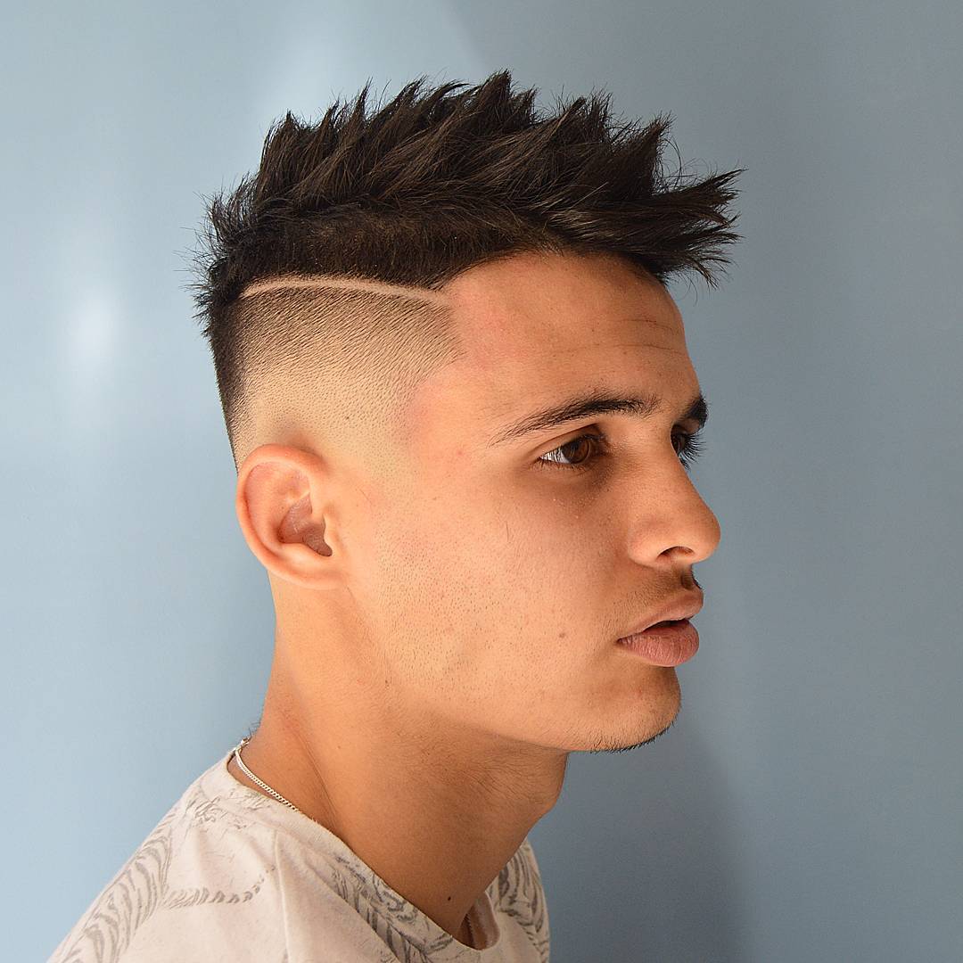 Skin fade spiky mohawk haircut for men