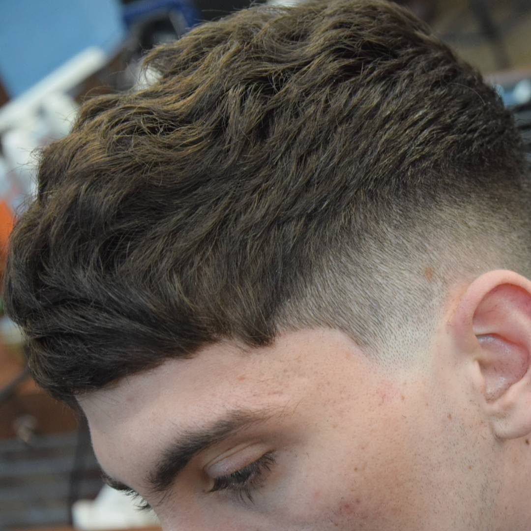 Medium length mens haircut with high fade