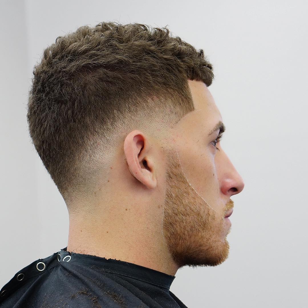 Short haircut for men with curly hair and drop fade