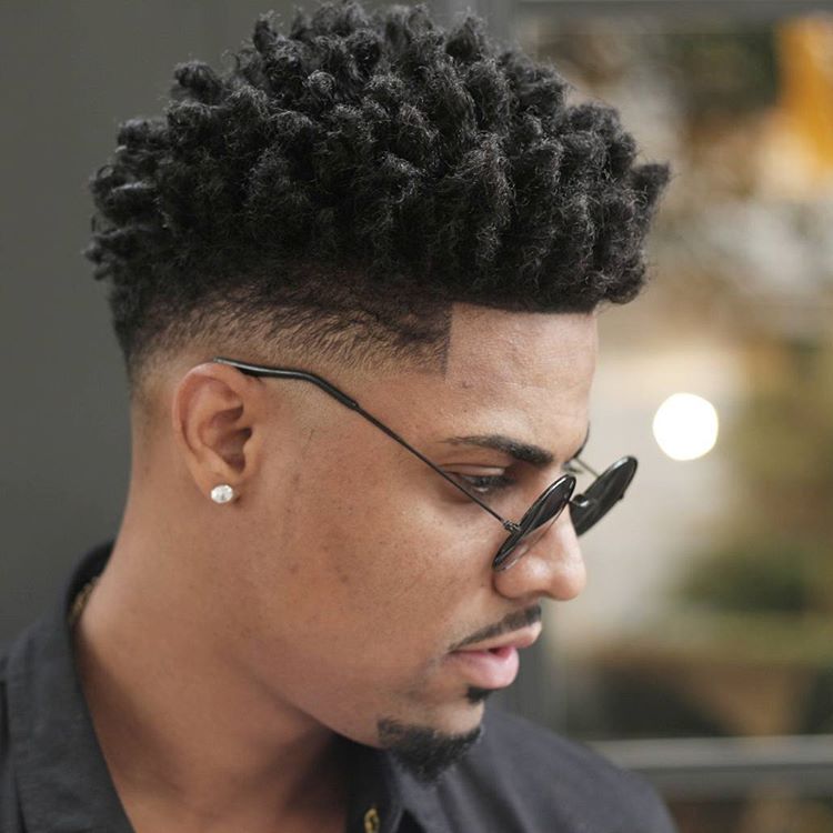 Messy hairstyle for men with thick hair and burst fade