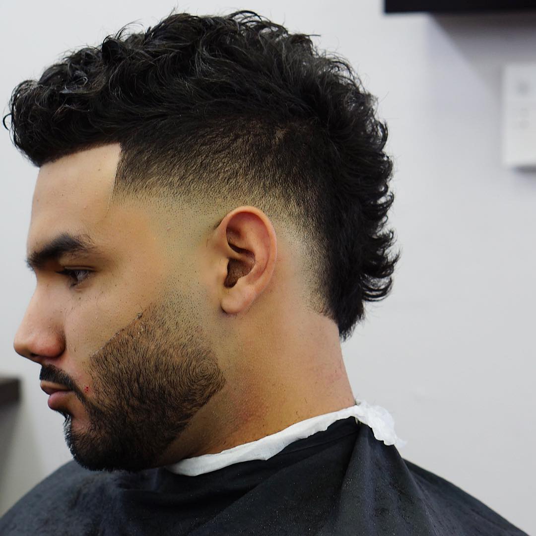 Cool mohawk drop fade haircut for curly hair