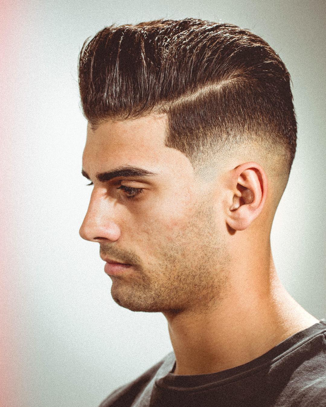 Side part pompadour hairstyle for guys