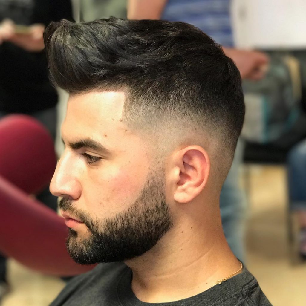 Quiff haircut with a high fade