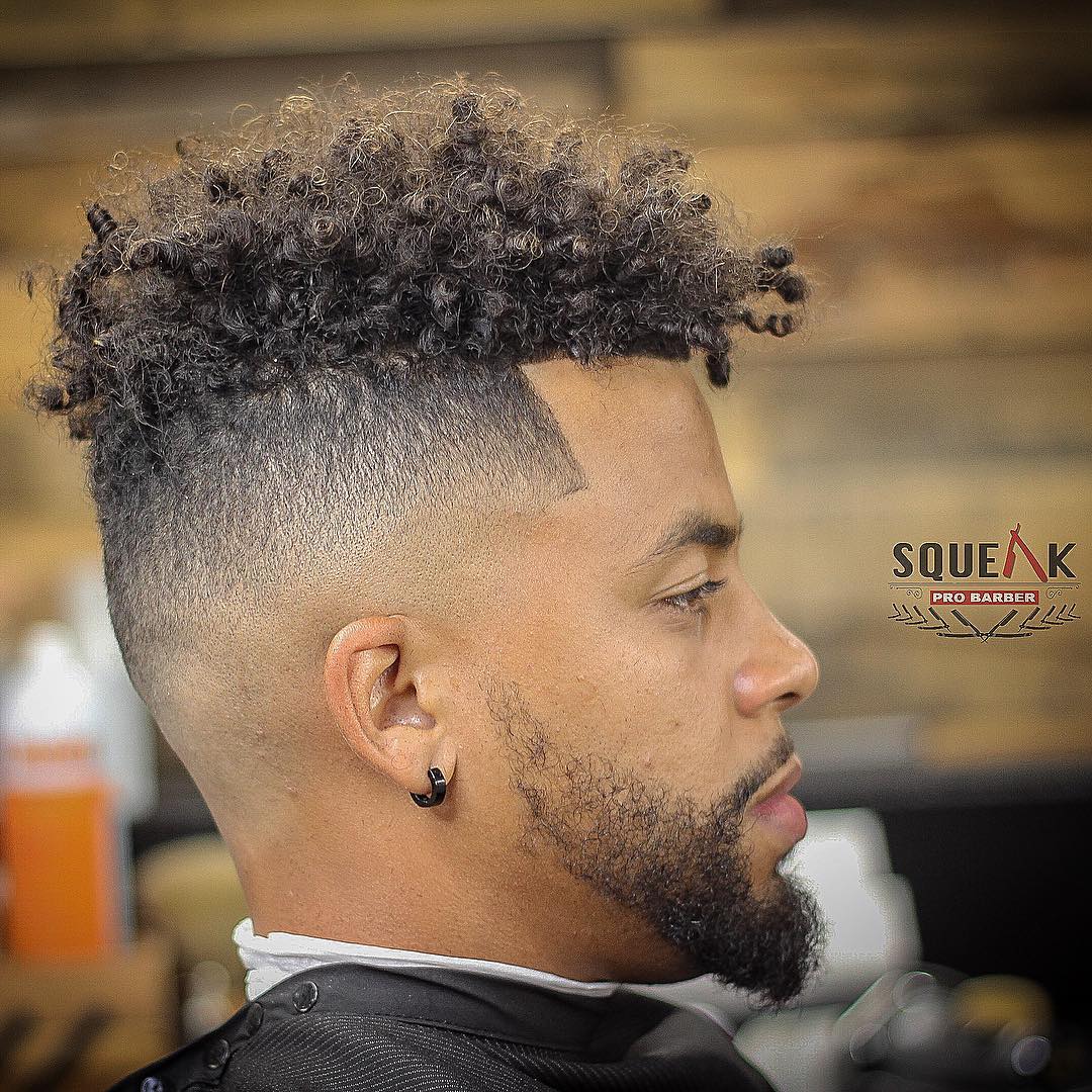 squeakprobarber mid skin fade haircut with curly top