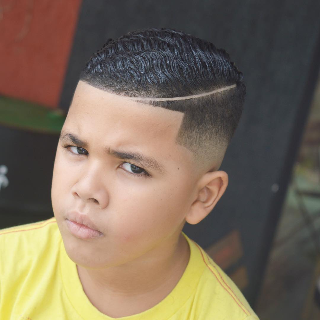 Wavy comb over fade haircut for boys