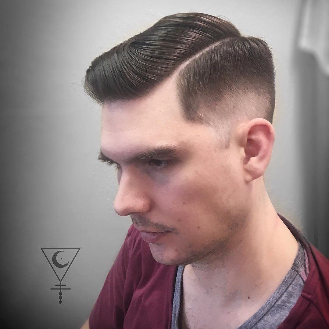 Slicked hair side part haircut