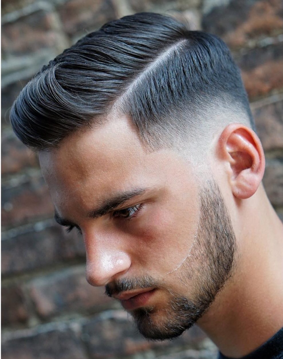 fade haircut with side part