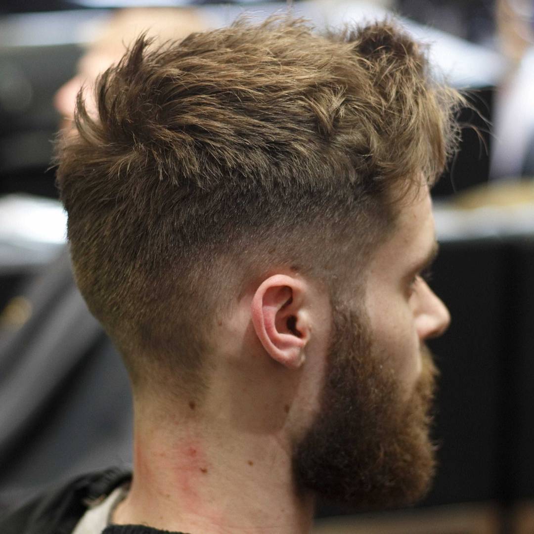 Short messy textured haircut for men high fade