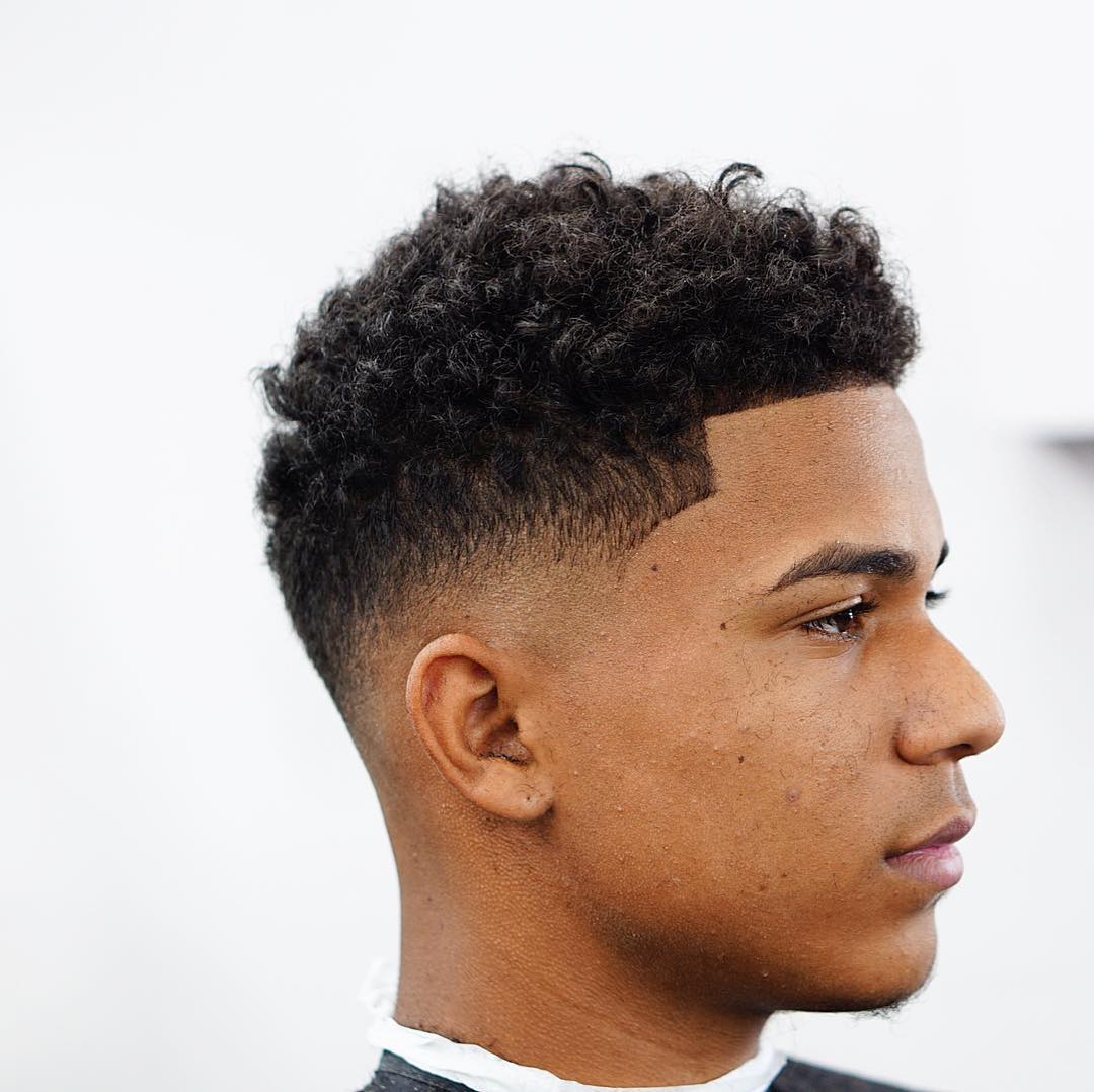 low fade haircut for men with natural curls criztofferson