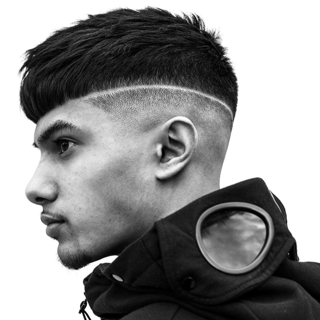 Textured fade haircut with line