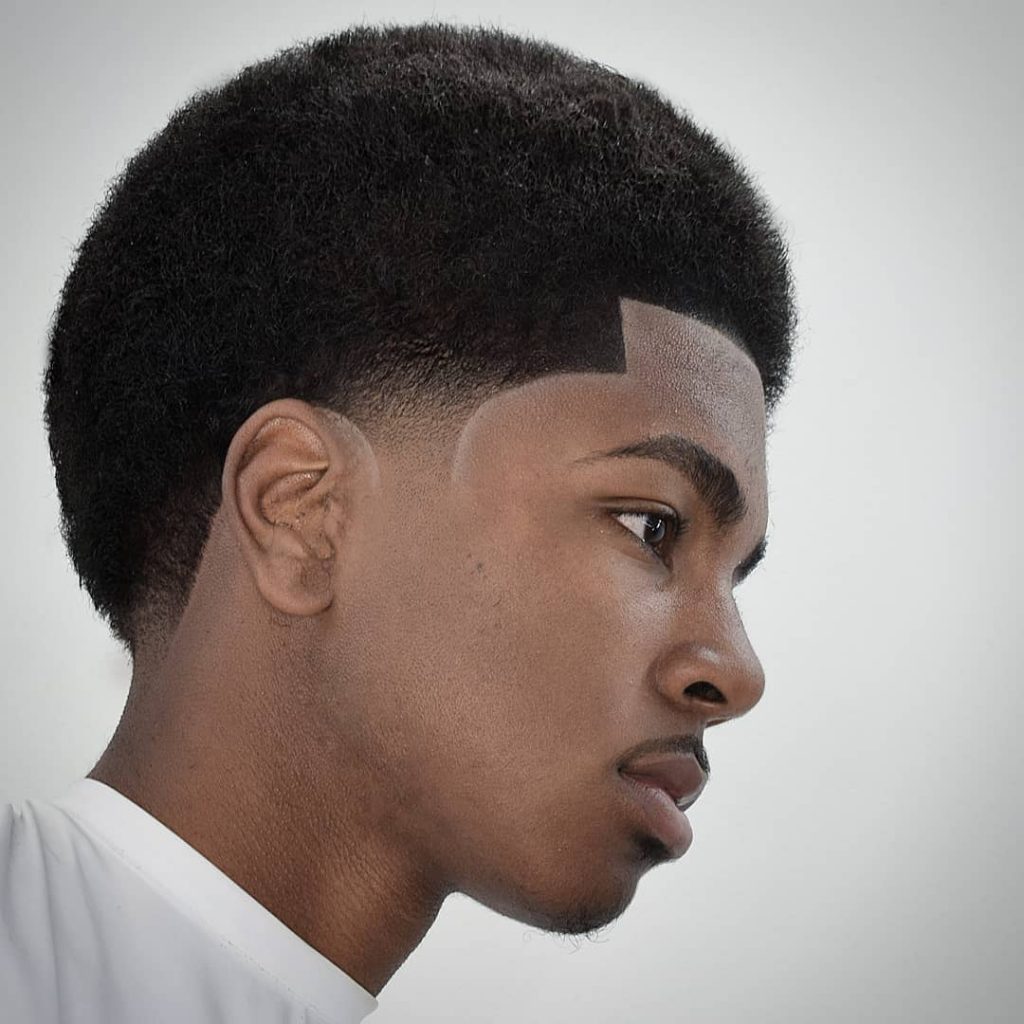 Afro haircut with temp fade