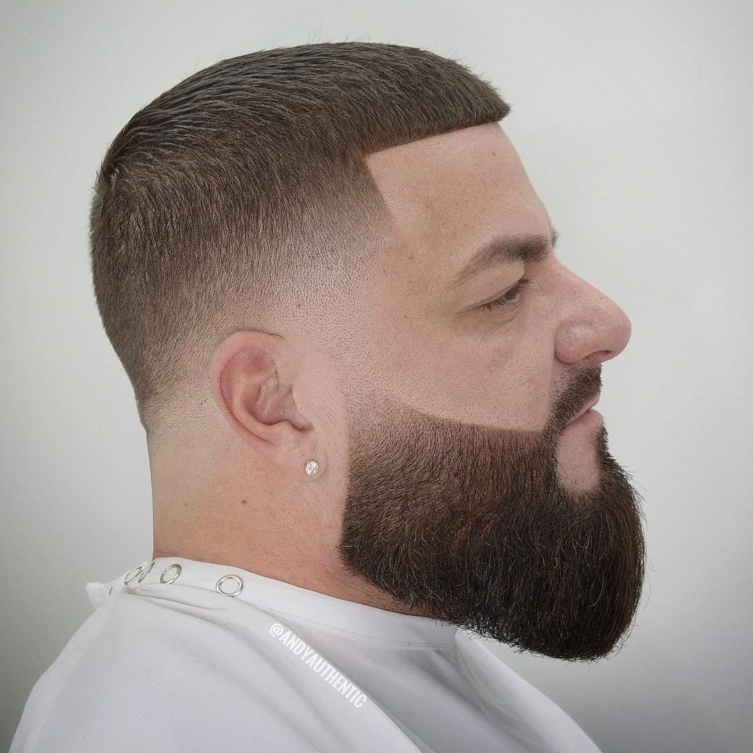 Low fade haircut with a disconnected beard
