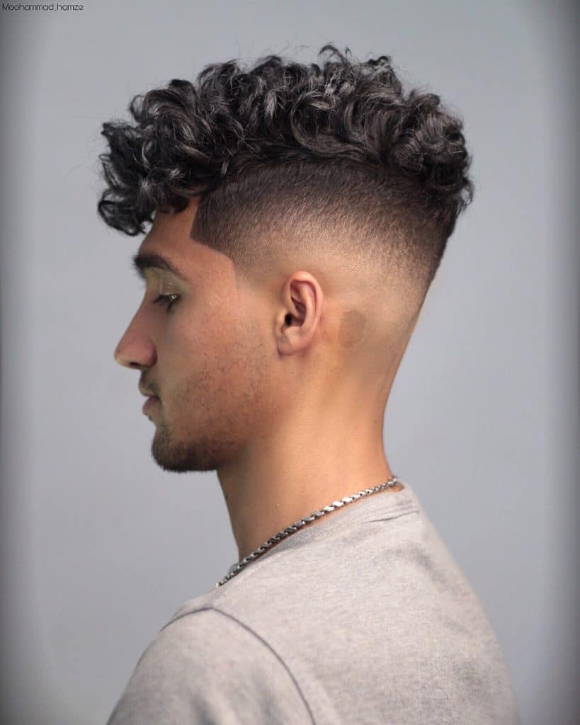 medium curly hair haircut with shaved sides