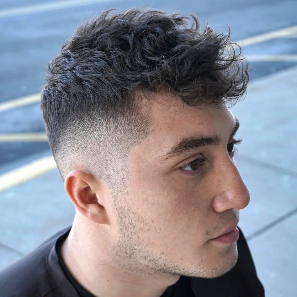 short haircut with burst fade and curly hair