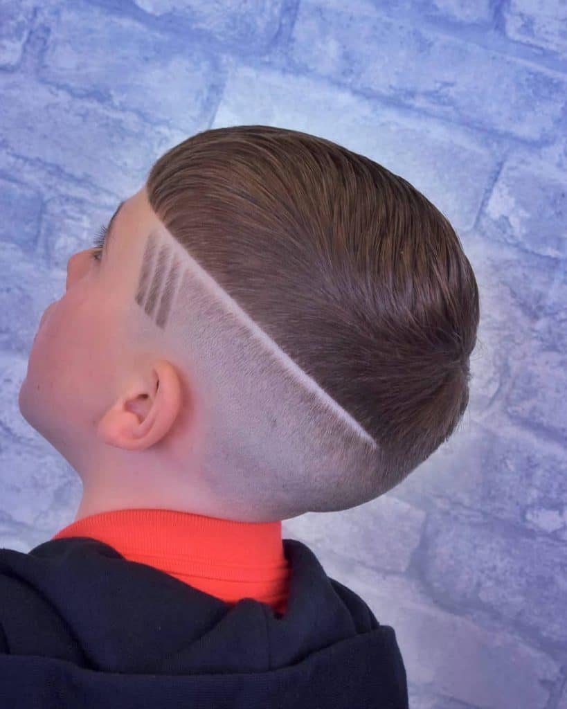 Bald fade haircut with line