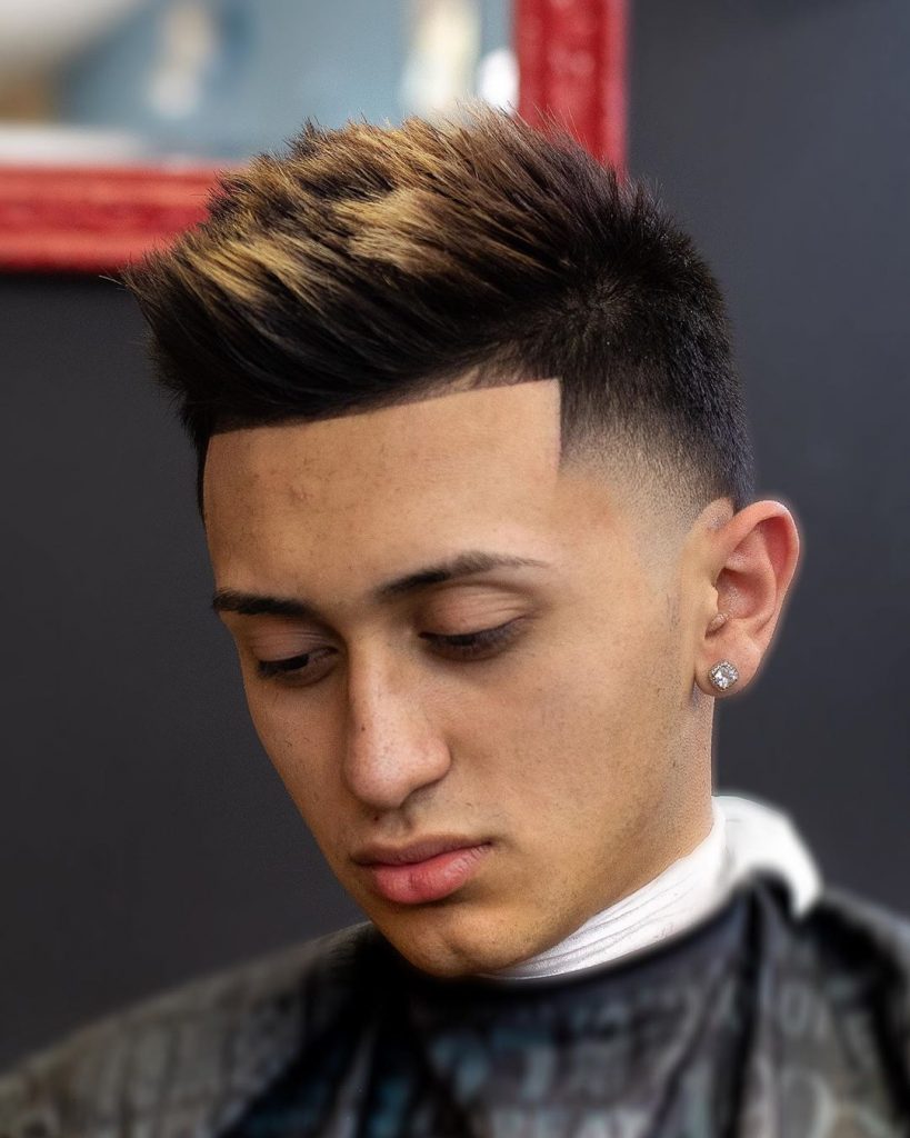 High temple fade + spiky textured hair