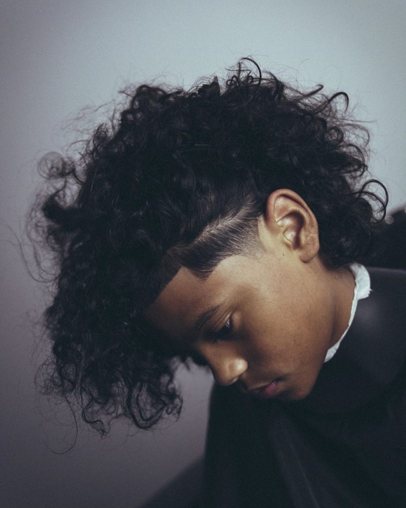 Long curly hair for men with temple fade
