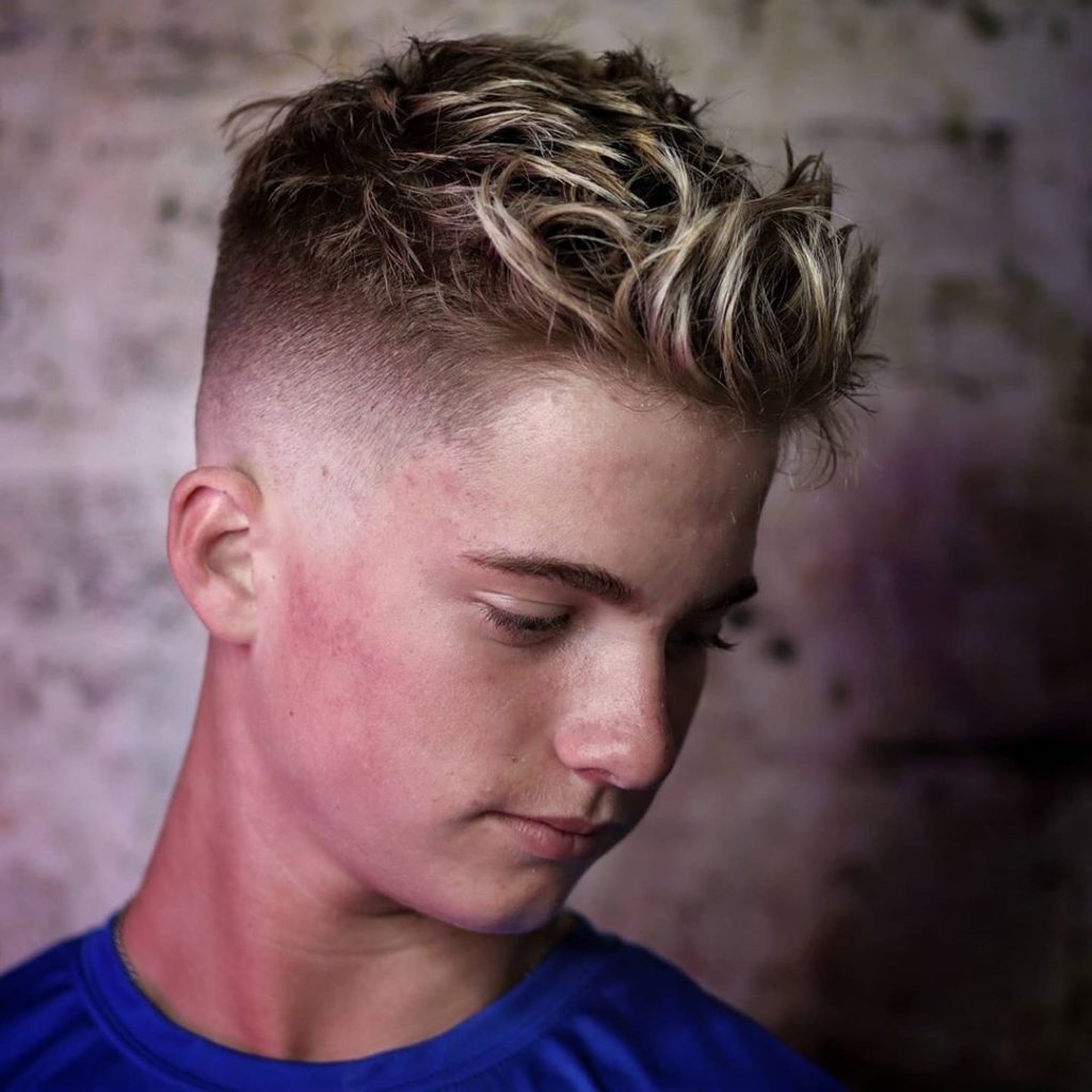 Medium-high fade haircut with spikes