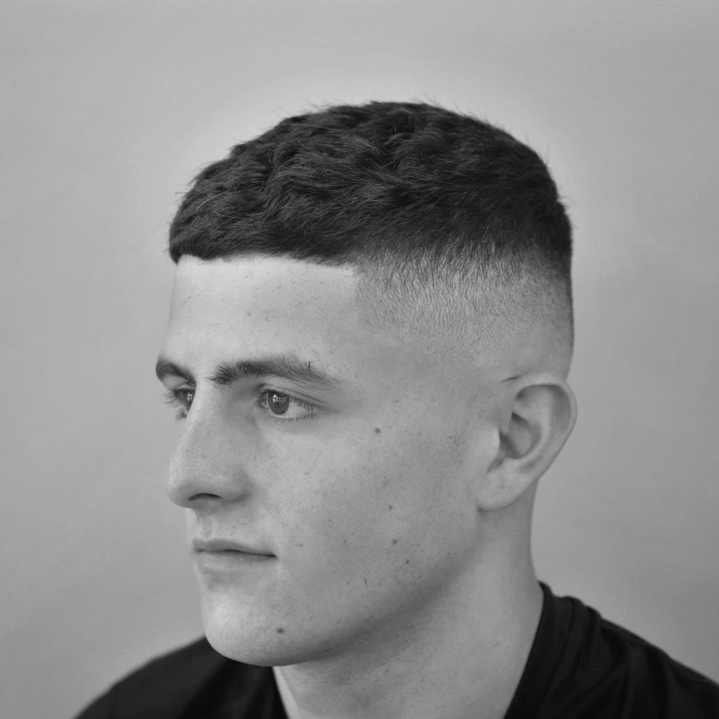 Short crop haircut with high fade