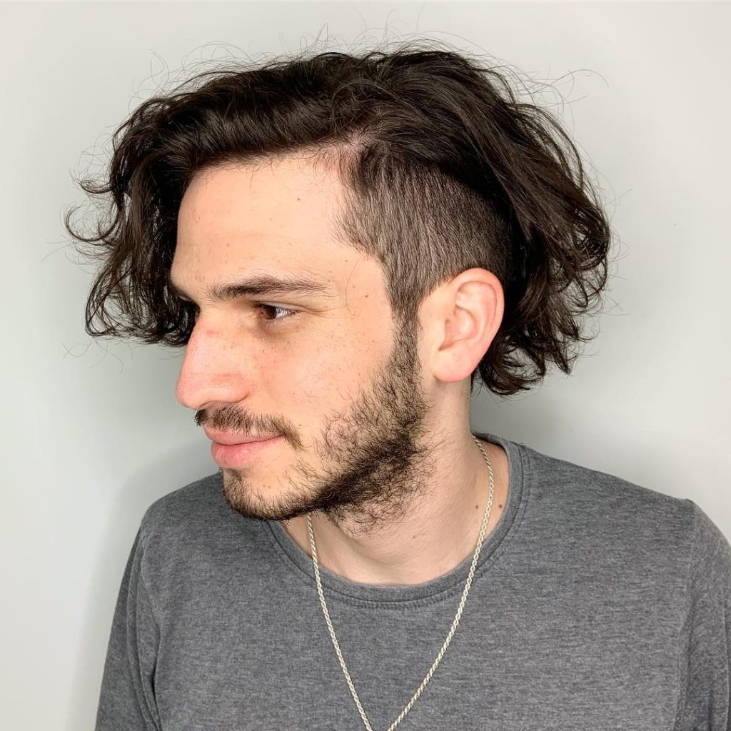 Long curly hair with undercut for men