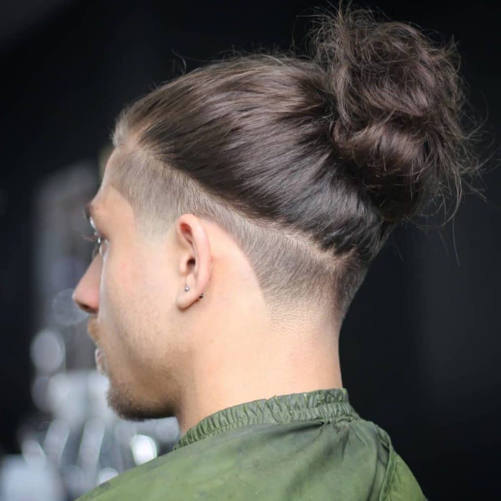 Long hair ponytail hairstyle for men with undercut shape up
