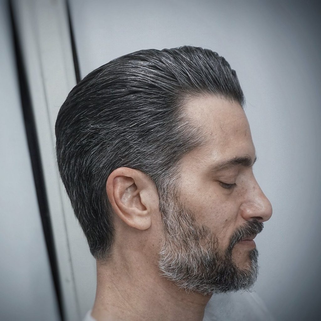 Slicked back hair for older men