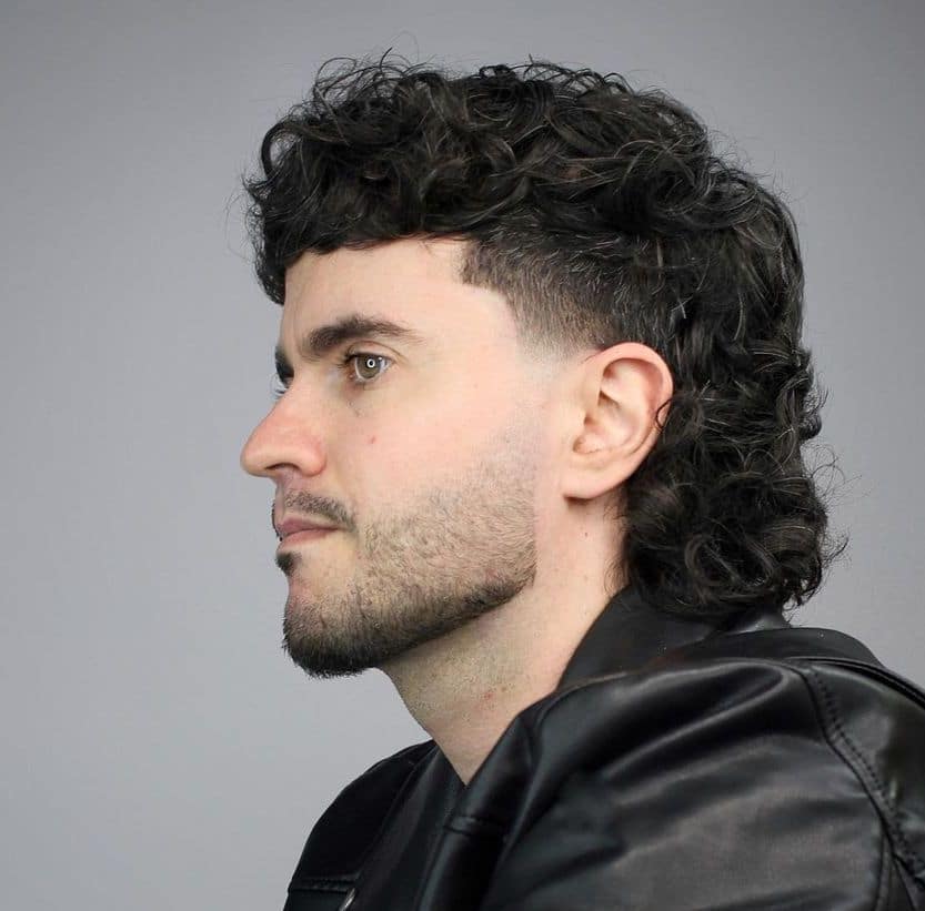 Wavy hair mullet with temp fade