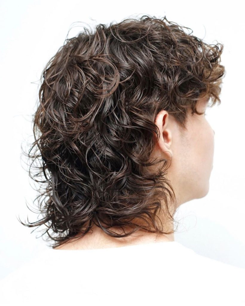 Curly mullet for men with bangs