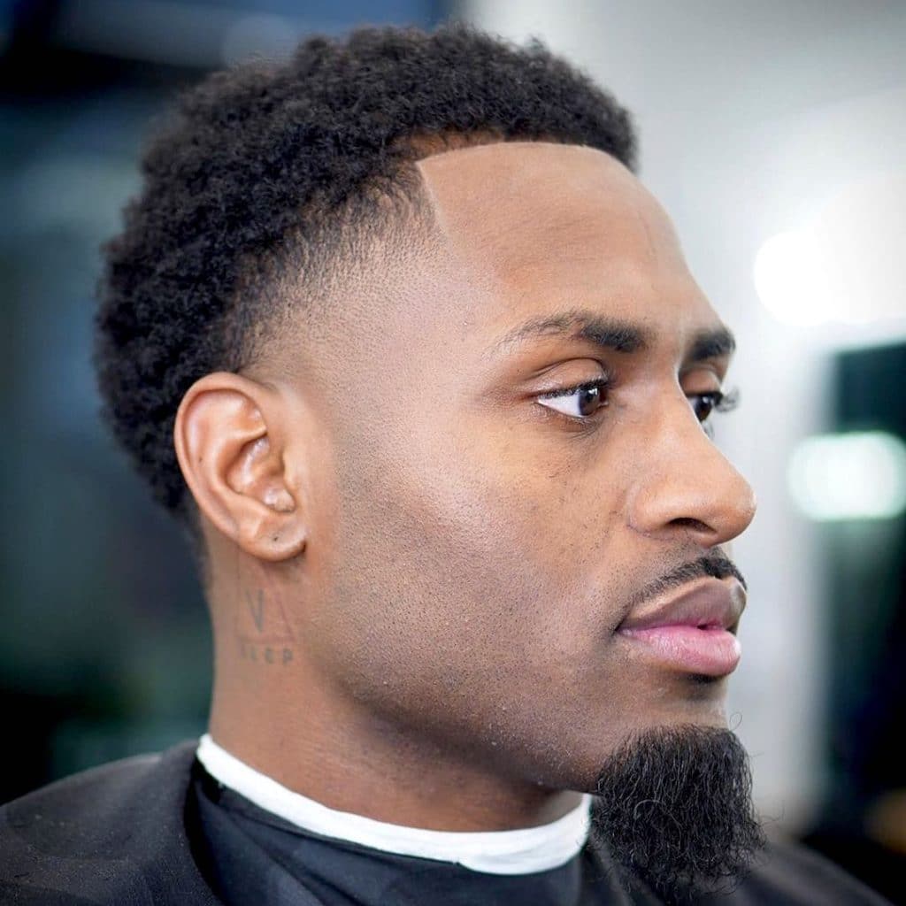 Taper haircut for Black men with goatee