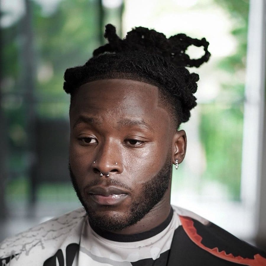 Line up with long dreadlocks Black men