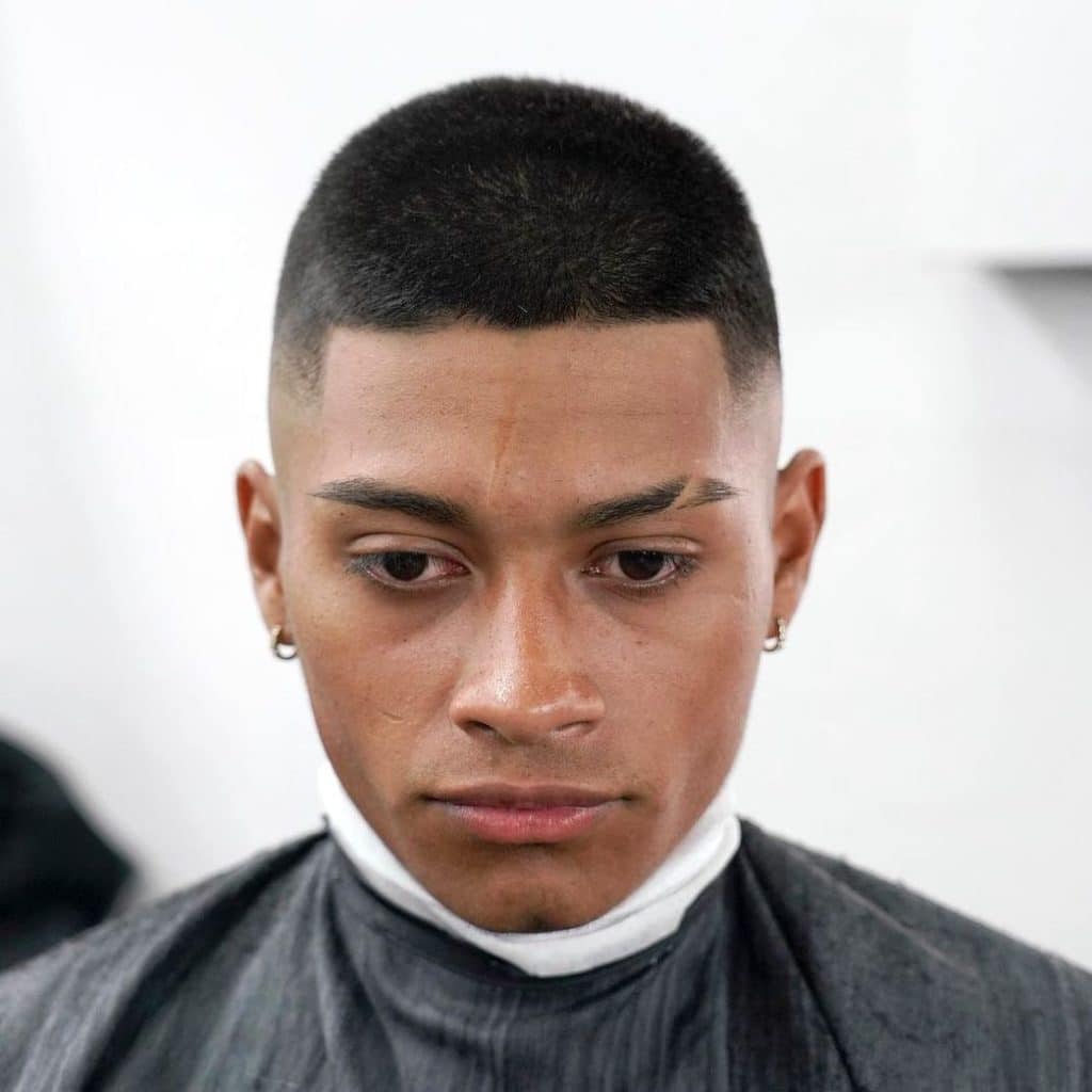 Short high fade haircut with line up and brow slash