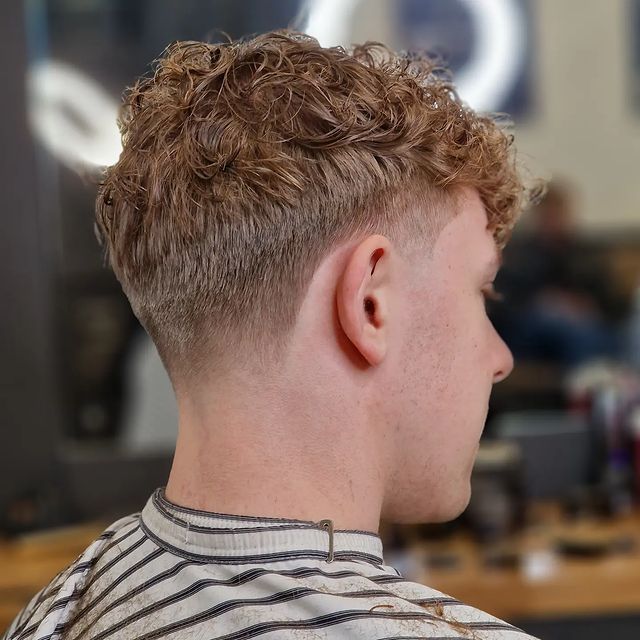 Curly crop haircut with taper fade